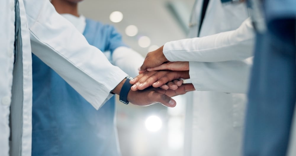 Medical leader hands